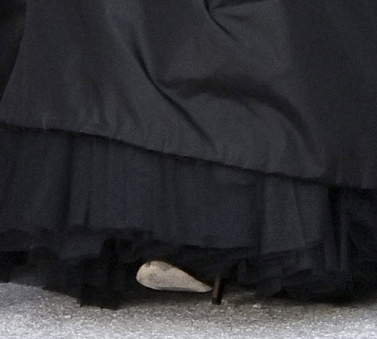 Jennifer Lopez wears a pair of black platform sandals with tall stiletto heels