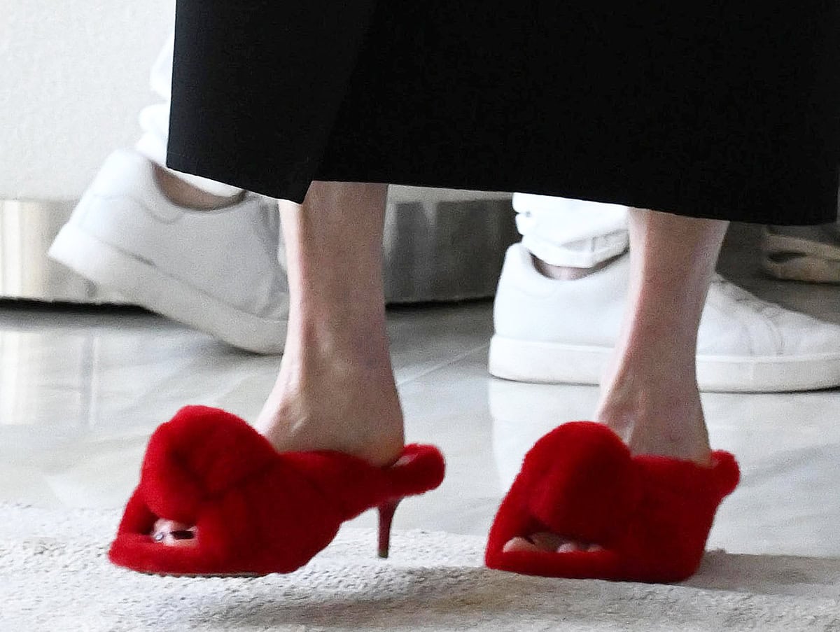 Julianne Moore steps out in slipper-style fluffy red wool mules by Bottega Veneta with thick knotted front straps and kitten heels