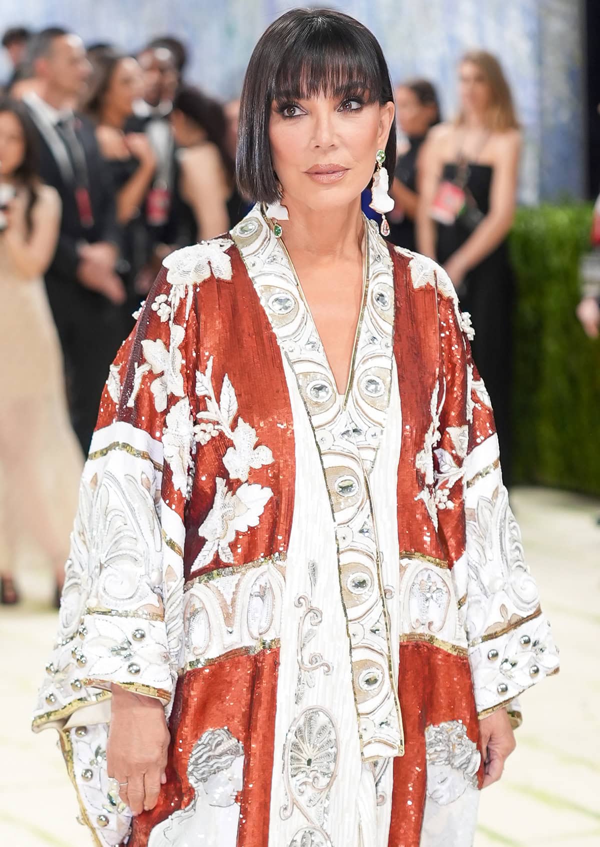 Kris Jenner pairs her crystal heels with a simple kimono dress embellished with sequins and bauble studs