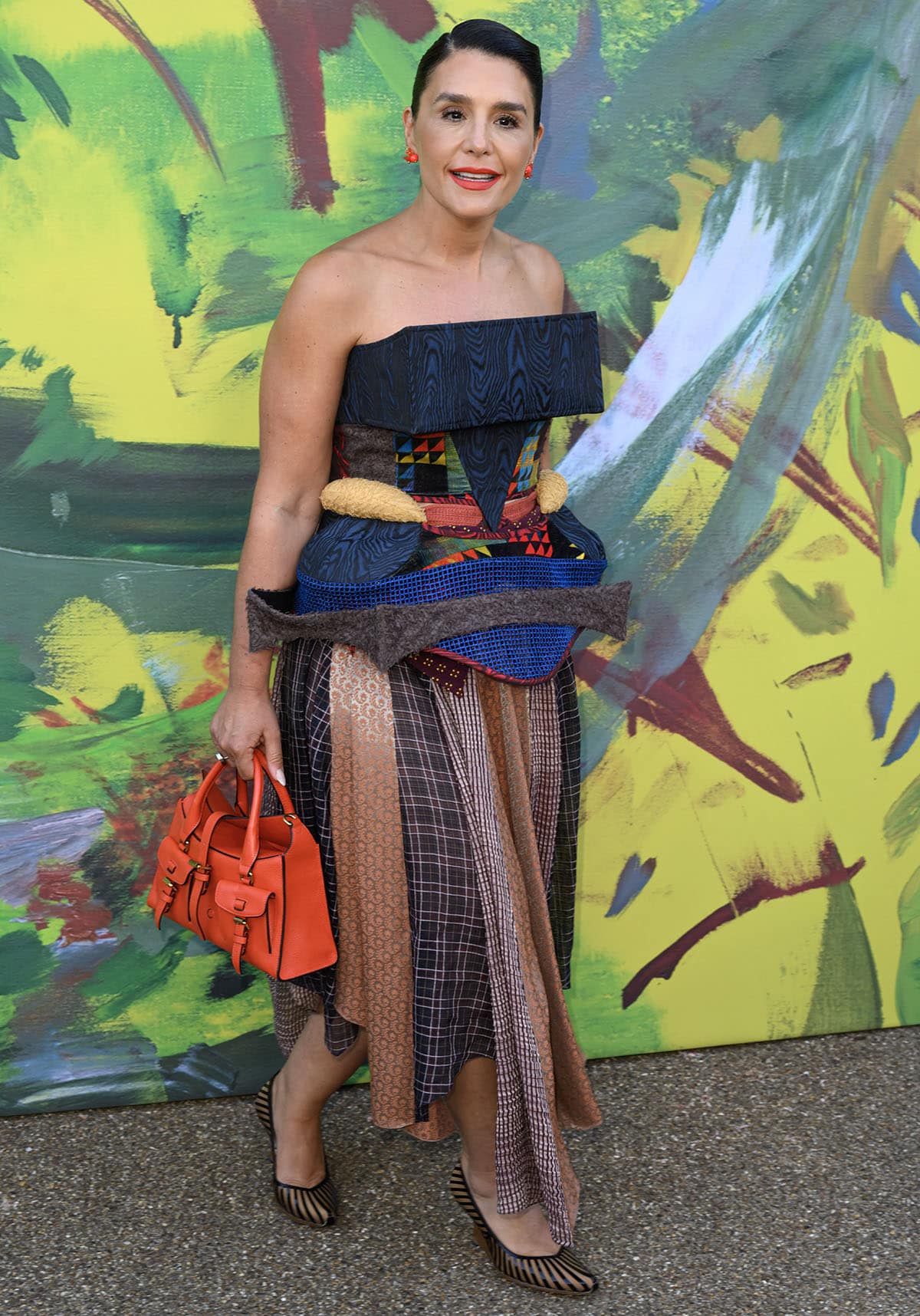 Jessie Ware teams her pumps with an elaborate Kiko Kostadinov dress featuring a mix of geometric patchwork, mesh inserts, and quilted textures