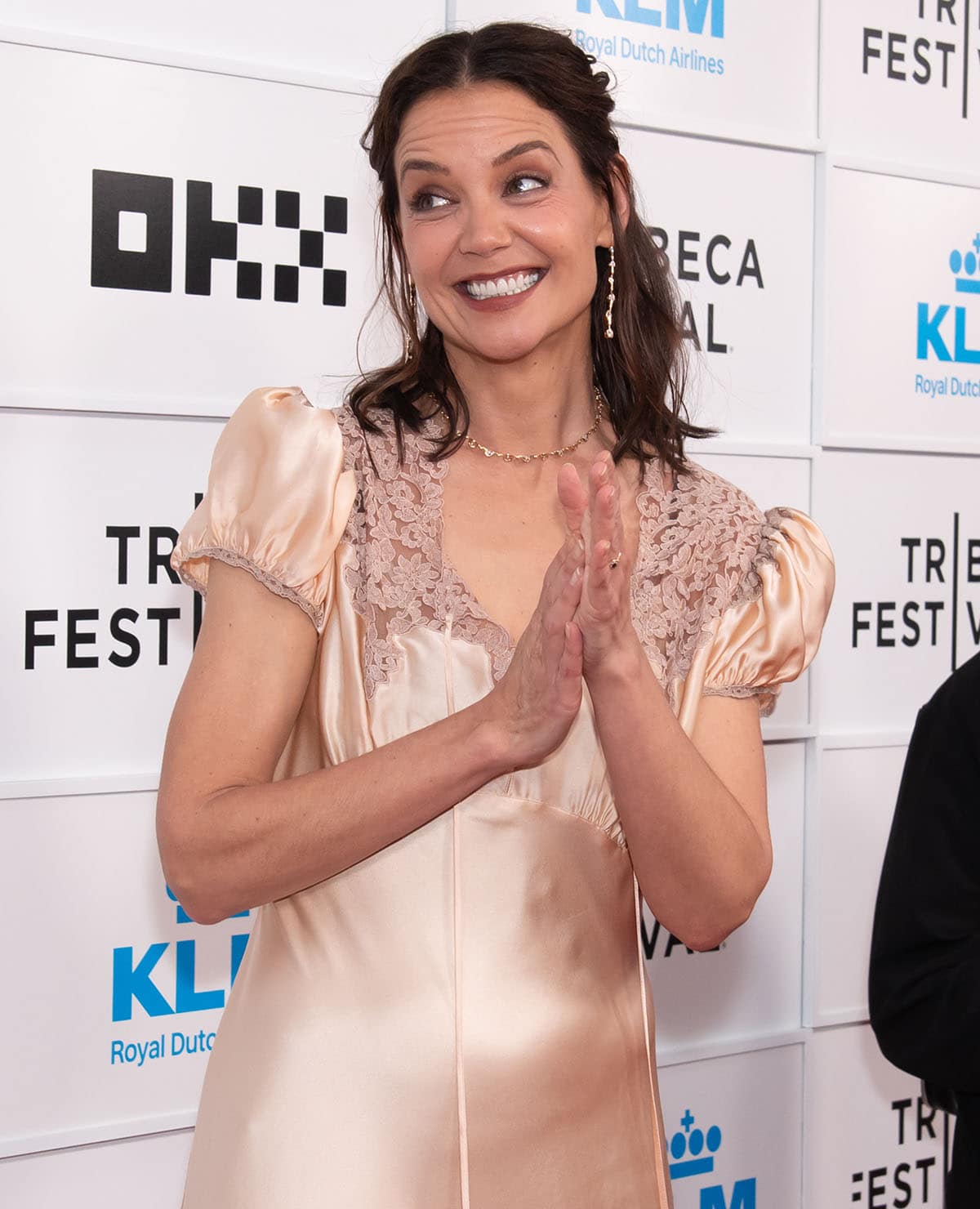 Katie Holmes looks sweet with her half-up, half-down wavy hairstyle, long earrings, and a matching necklace