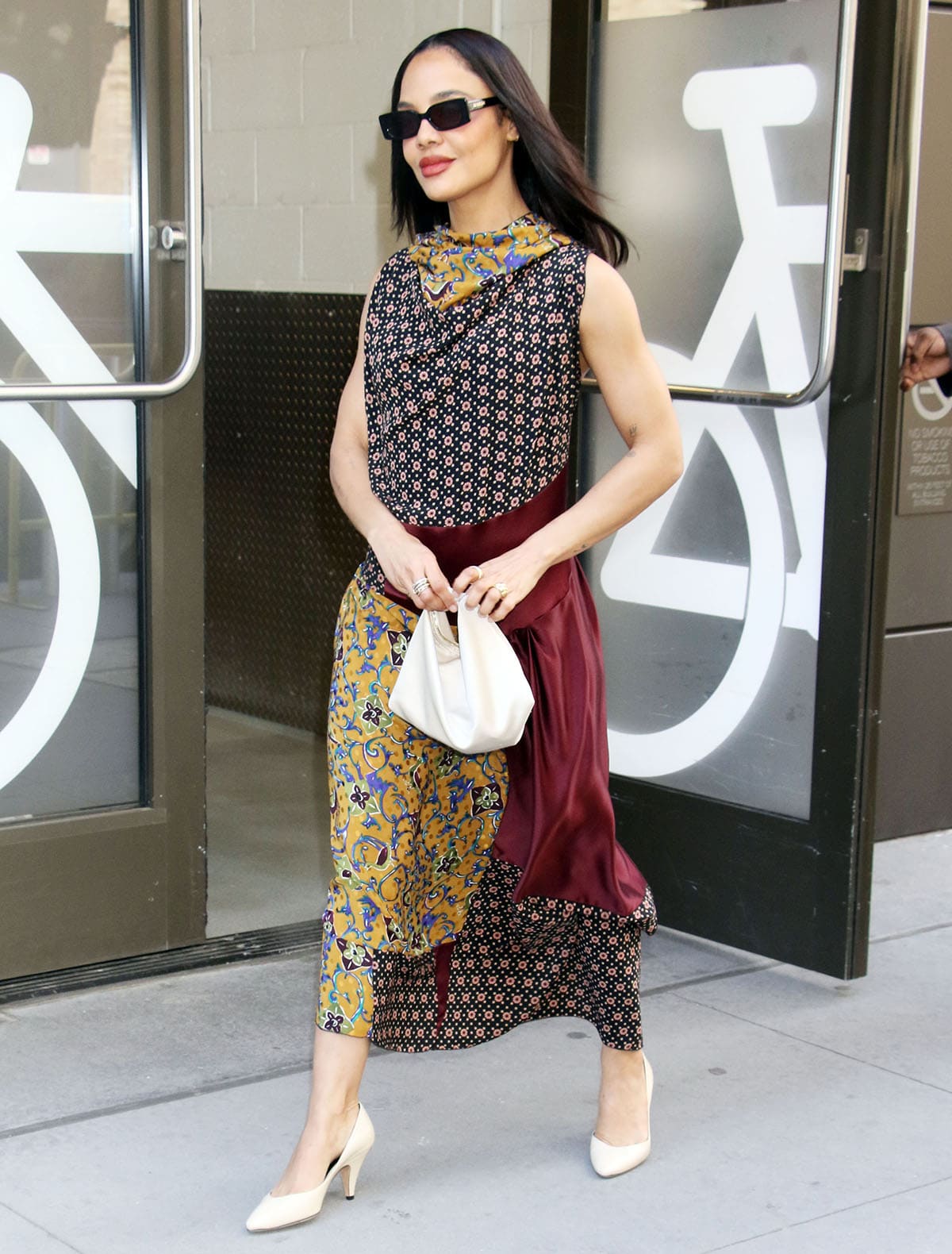 Tessa Thompson balances the simplicity of her shoes with the busyness of her Giovanna Flores dress, featuring paisley, dots, and color-blocked panels