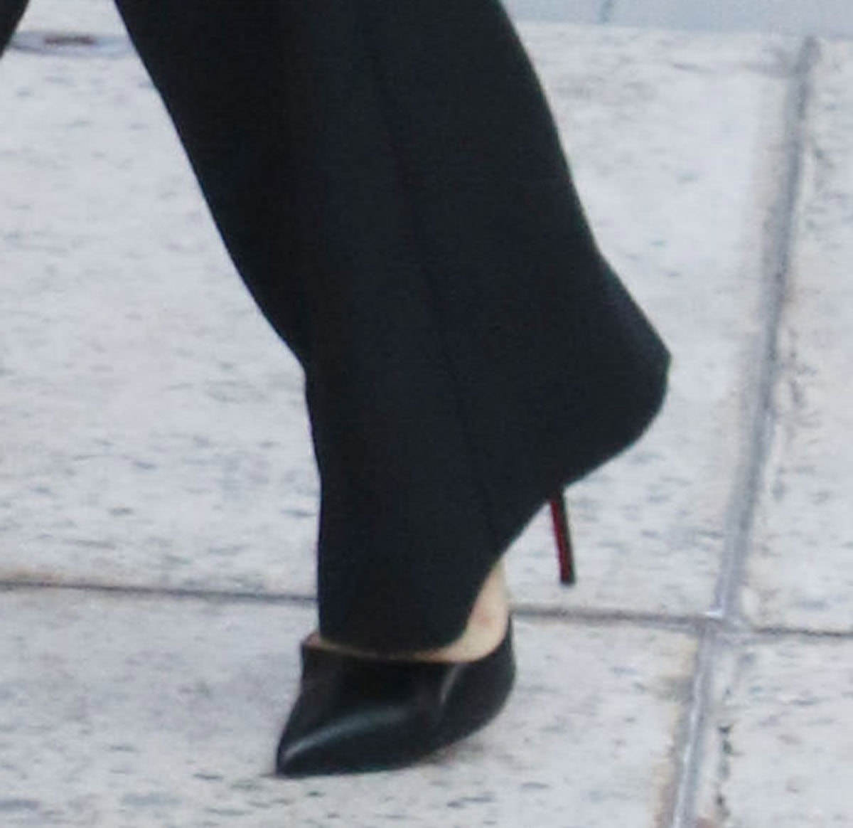 Anya Taylor-Joy elevates her simple black-and-white look with the Christian Louboutin “Iriza” d'Orsay pumps