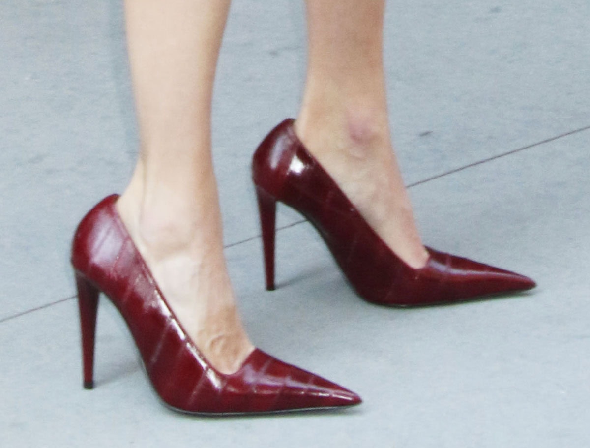 Emmy Rossum slips into Giuseppe Zanotti's High Desire pumps in bordeaux eel skin leather with squared vamps, pointed toes, and high heels