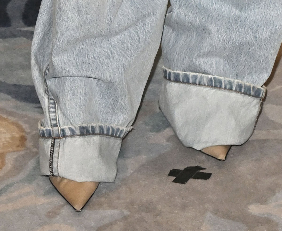 Jessica Biel lets pointed-toe nude leather pumps peek out beneath her oversized Sportmax jeans, using sleek stilettos to elevate the relaxed double-denim look