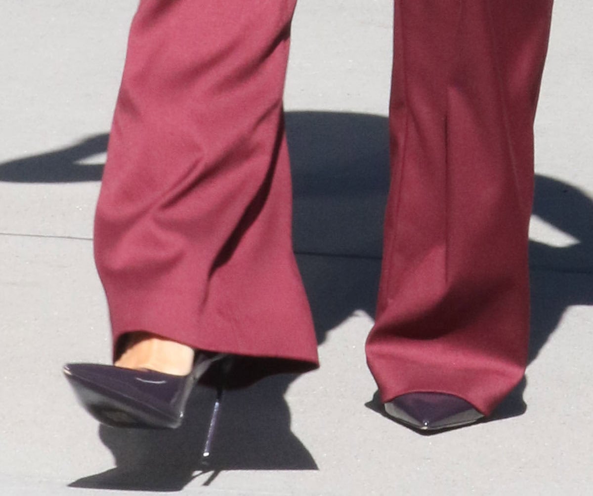 Minka Kelly slips into a pair of sophisticated shiny pumps with pointed toes and slim stiletto heels