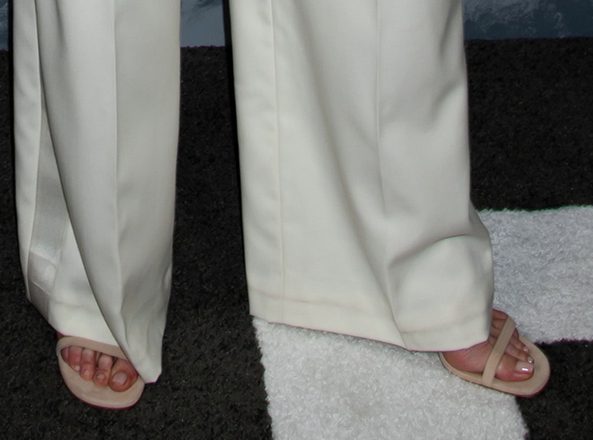 Nicole Kidman keeps her footwear simple, wearing minimalist beige open-toe sandals with slim straps and wide open toes