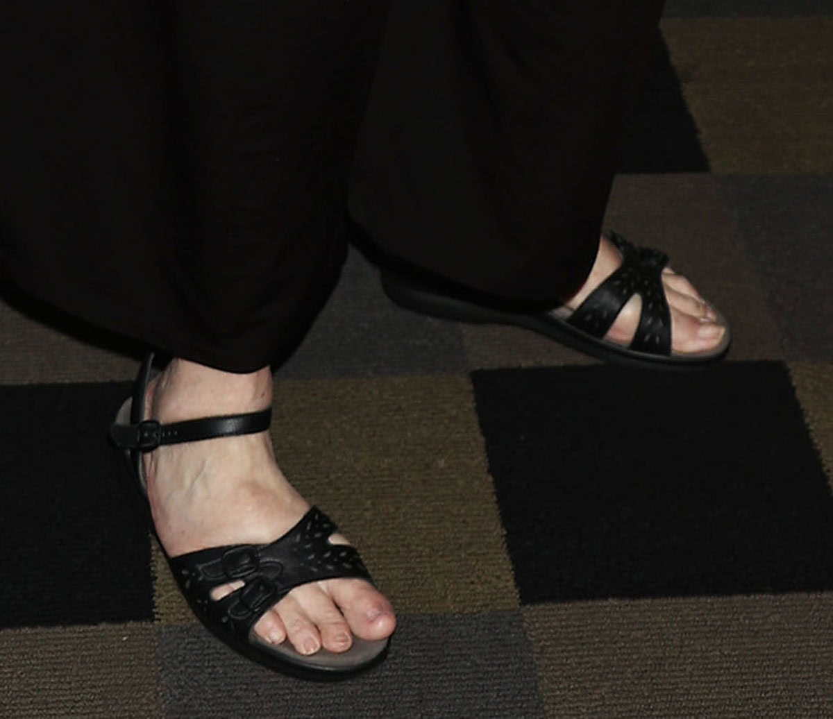 Annette Deao embraces comfort in her SAS sandals featuring laser-cut detailing across the double adjustable toe straps, an adjustable ankle strap, and low wedge soles
