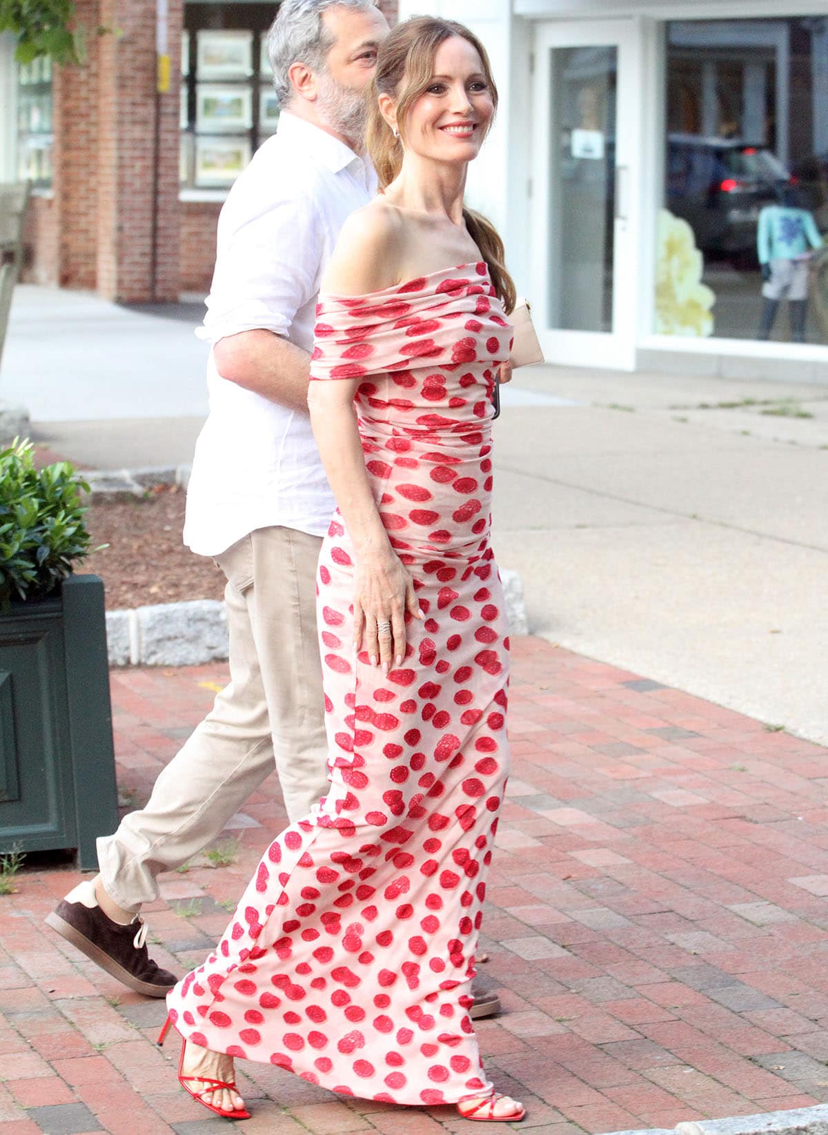 Leslie Mann matches her red heels with her pink-and-red Stella McCartney dress, made from recycled mesh with hand-painted raspberries all over