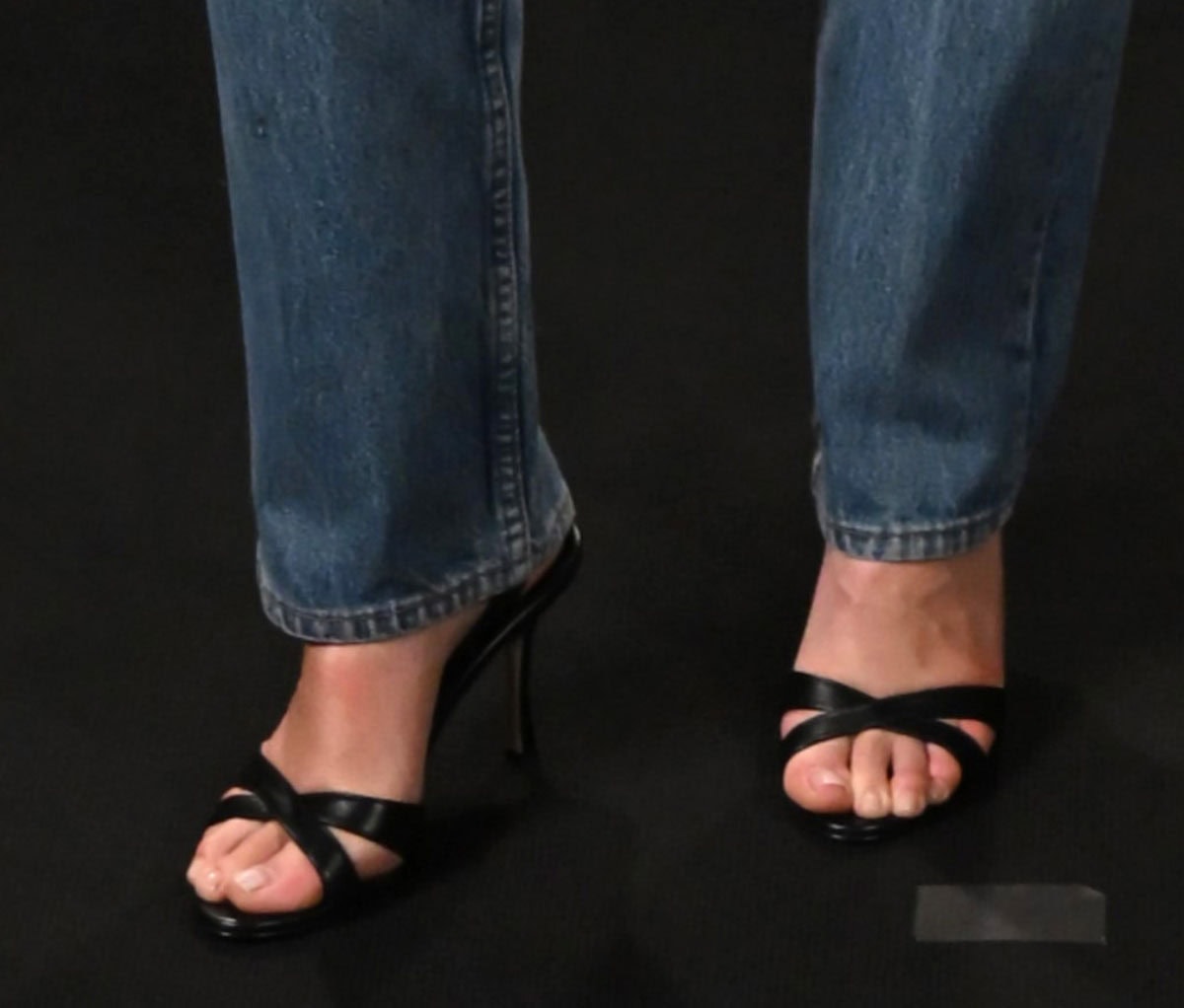 Olivia Wilde elevates her more relaxed photocall look with the Manolo Blahnik “Callasli” sandals featuring crossover front straps, a slingback strap, and slightly flared stiletto heels