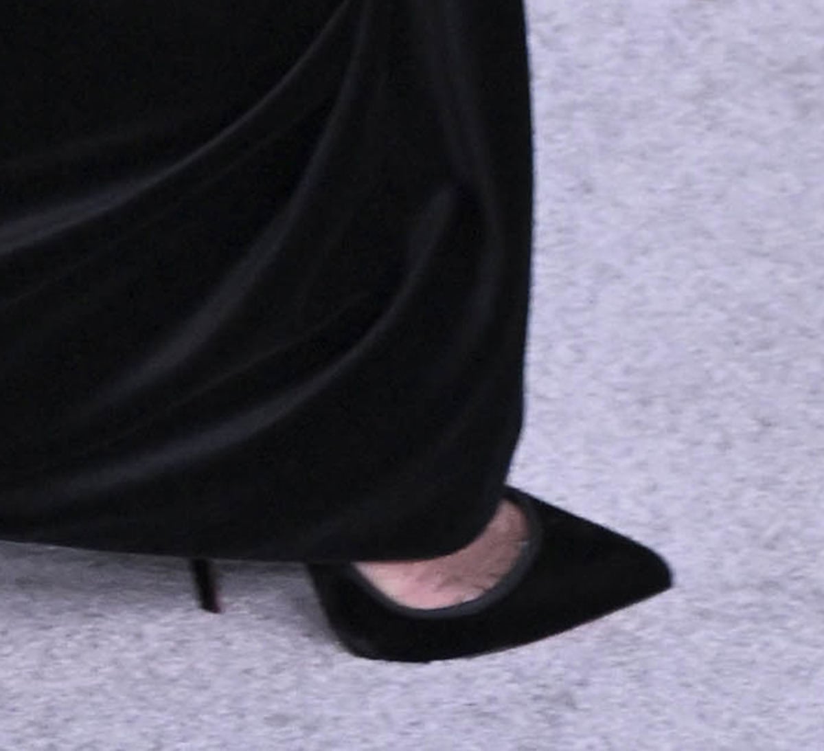 Cynthia Erivo wears black suede Christian Louboutin So Kate pointed-toe pumps with stiletto heels