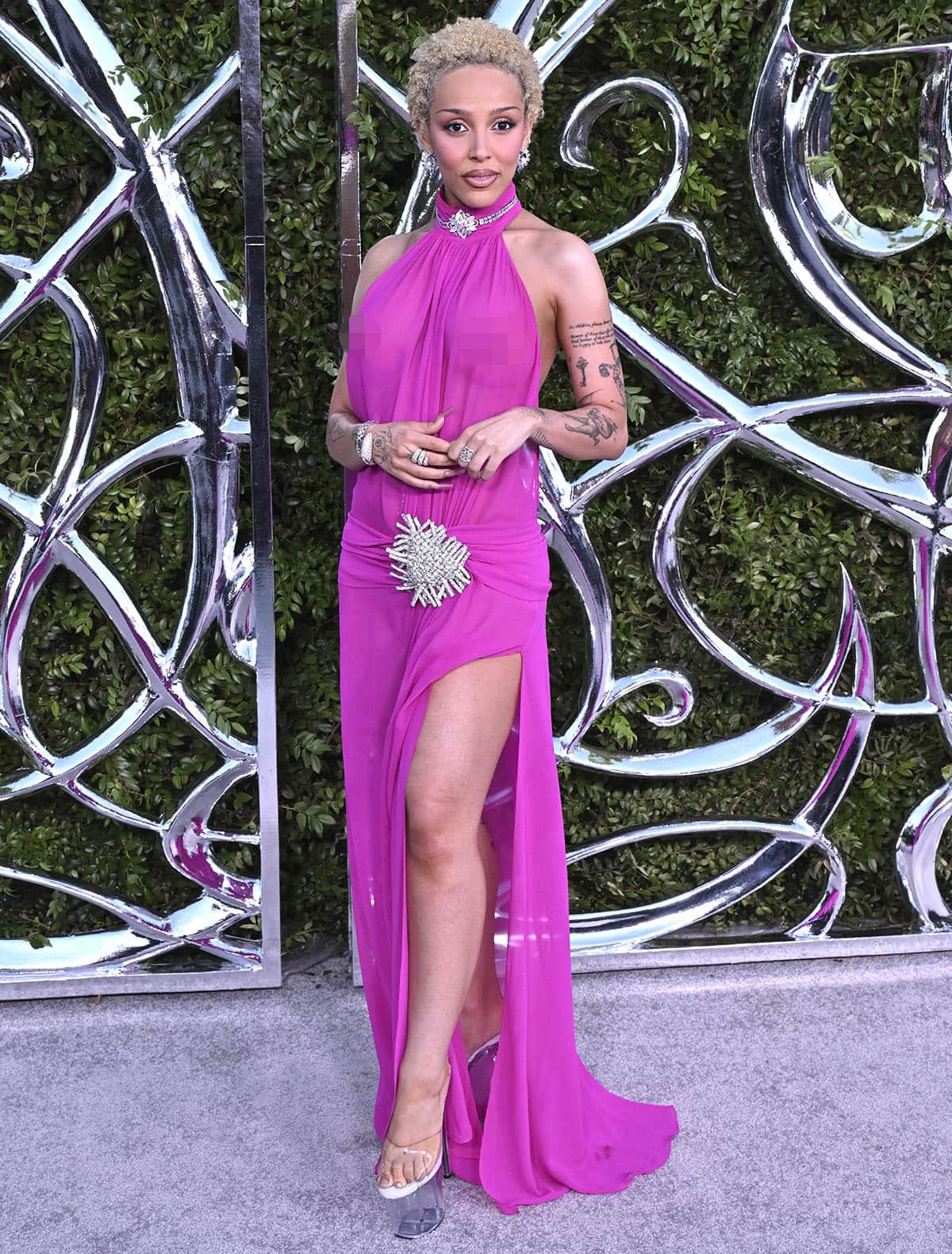 Doja Cat wears a hot-pink Nue Studio Daphne halter dress with towering clear platform mules