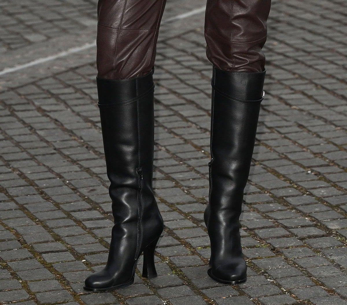 Jodie Turner-Smith wears black Burberry Pillar leather knee-high boots with sculptural heels at London Fashion Week